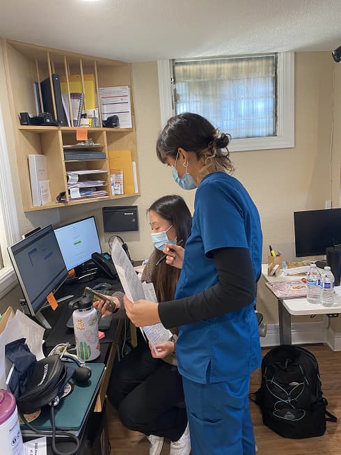 Image of JVMC Workers handling documents