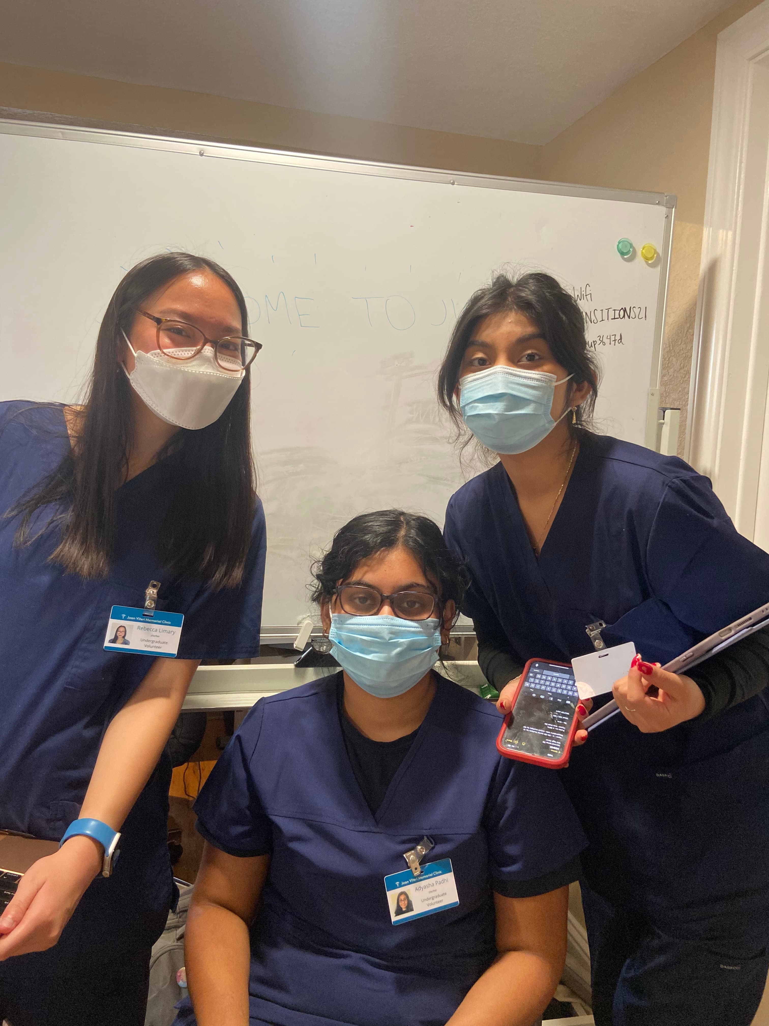 Image of JVMC Workers grouped together smiling